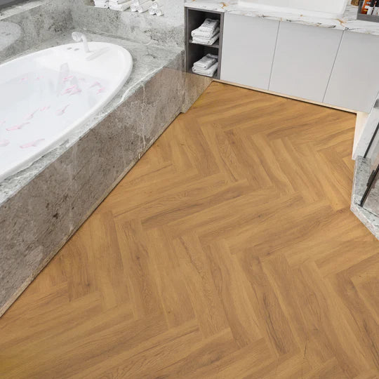 Luxury California Oak herringbone LVT, ideal for residential and commercial spaces with underfloor heating compatibility.