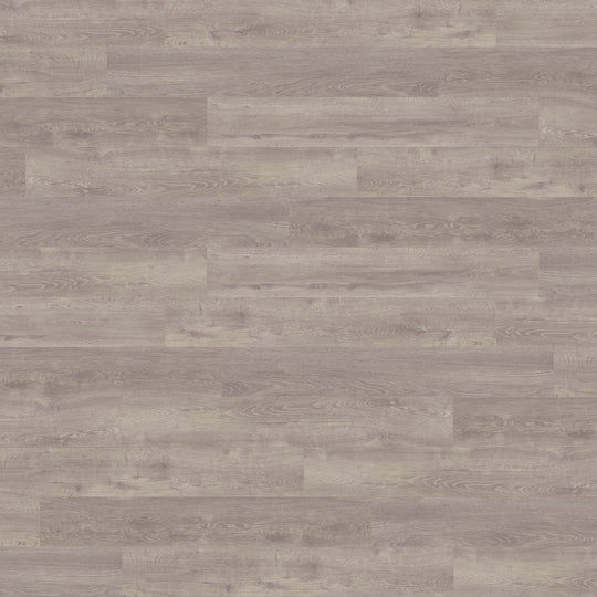 Close-up of County Oak LVT, showcasing its warm and traditional oak finish in large plank format.