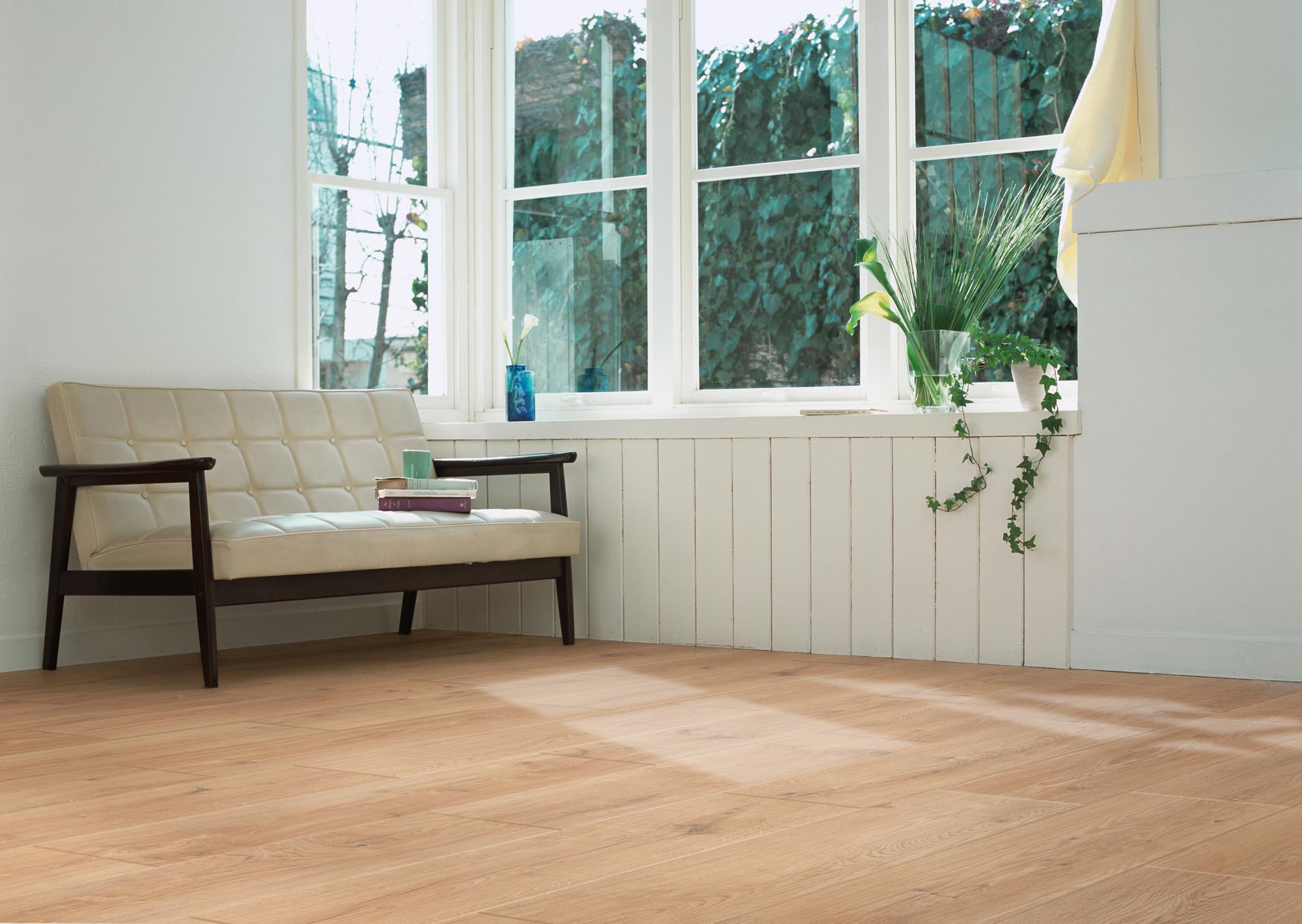 Durable Hall Oak Golden Plank LVT with bevelled edges and glued fitting.