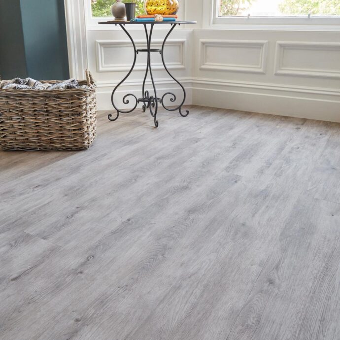 Close-up of Fumed Oak Light Plank LVT flooring by AClass Flooring – durable, scratch-resistant, and easy-to-clean luxury vinyl plank for high-traffic areas.
