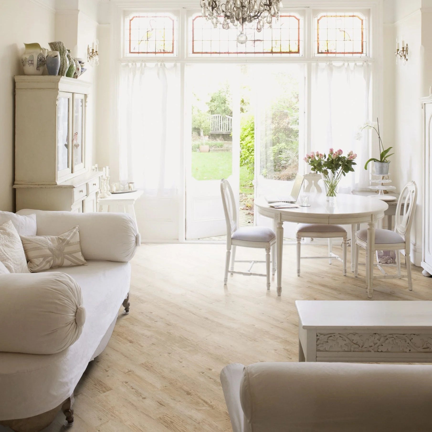 Luvanto Design Wood Plank flooring in Bleached Larch with light wood tones in a cosy lounge living room
