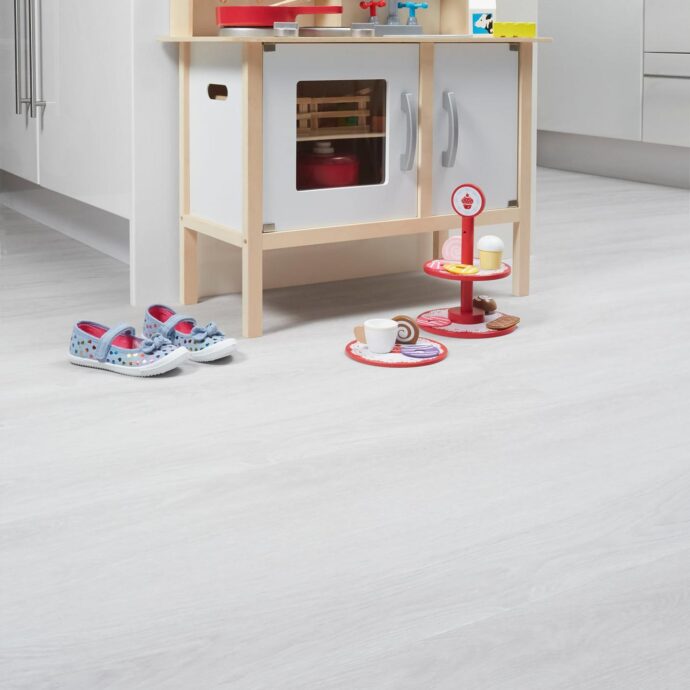 Alpine Mist Luxury Vinyl Tile by AClass Flooring – sleek, light grey design with a wood-effect finish, offering both style and practicality for your home.