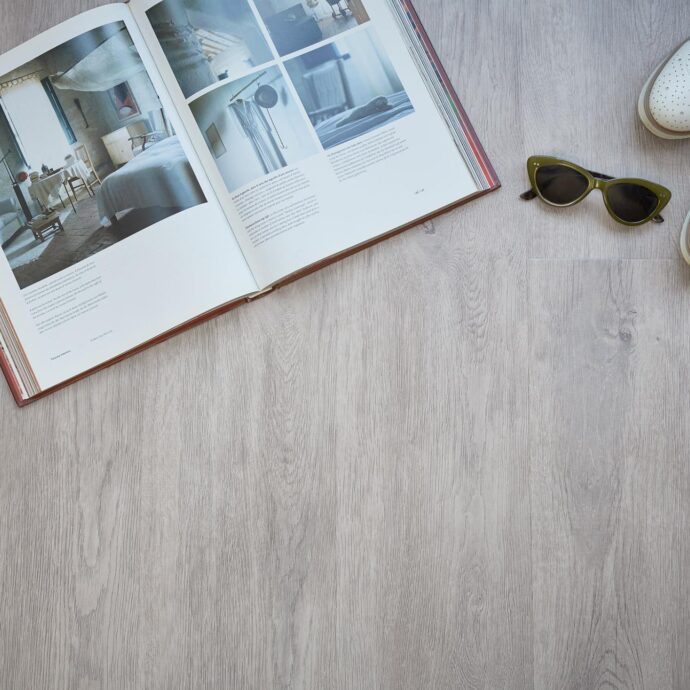Fumed Oak Light Plank LVT flooring by AClass Flooring – sleek, waterproof luxury vinyl planks with a soft oak design for a sophisticated home interior.