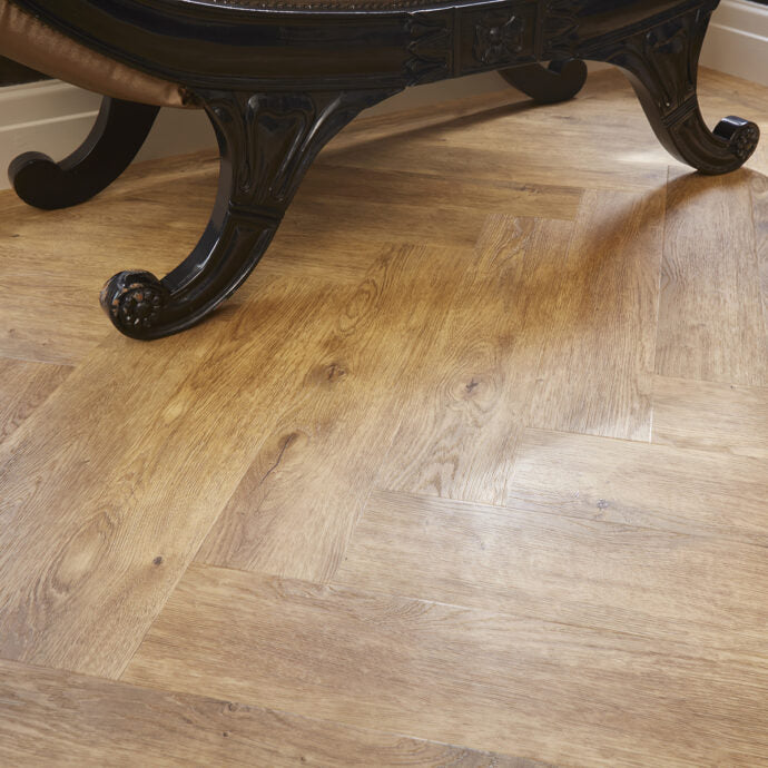 Glue-down Carpenters Oak Parquet herringbone LVT flooring, combining timeless oak tones with long-lasting performance.