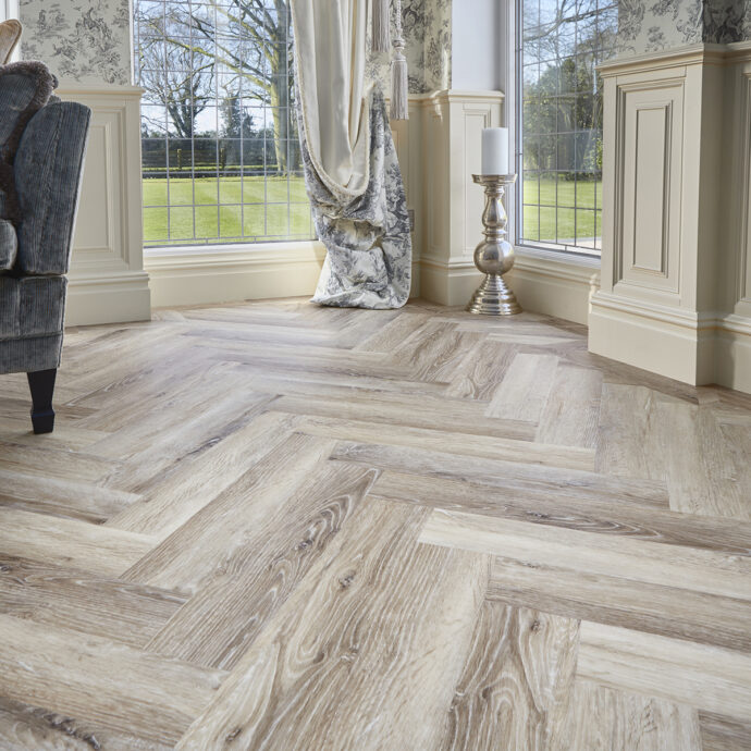 Blonde Oak Parquet herringbone luxury vinyl tile LVT flooring in soft blonde oak tones, part of the Natural Timbers Parquet collection.