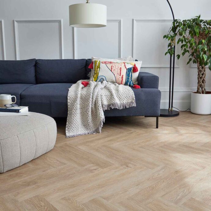 Naked Oak Parquet herringbone luxury vinyl tile flooring in beige and oak tones, part of the Natural Timbers Parquet collection
