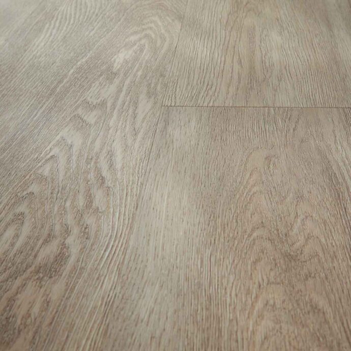 Close-up of Naked Oak LVT plank showing soft oak wood tones and natural grain texture.