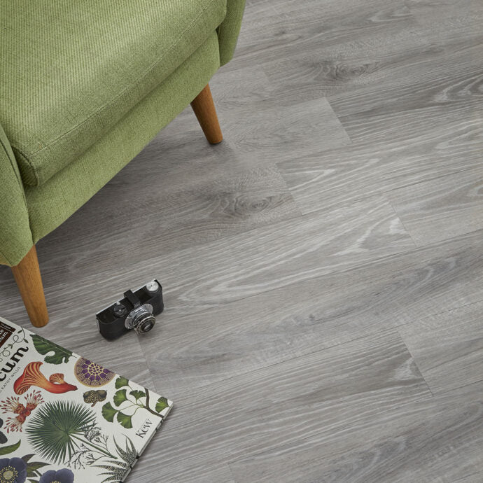 Close-up of Silver Ash LVT planks by AClass Flooring – durable, water-resistant glue-down luxury vinyl flooring with a chic wood-effect design.