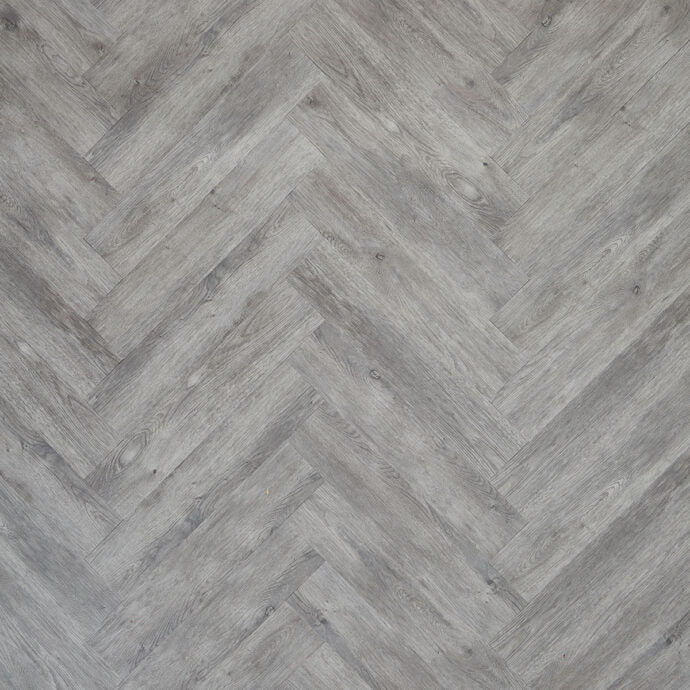 Glue-down Weathered Timber Parquet herringbone LVT flooring, offering durability and rustic appeal for modern interiors.