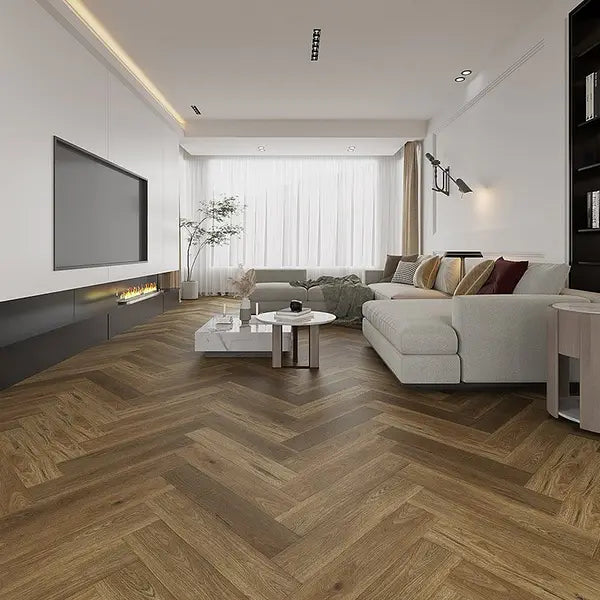 Alva parquet herringbone LVT Collection in English Oak, installed in a cozy living room