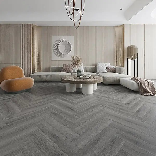 Living room featuring Alva Millennium Oak LVT in herringbone design, adding a classic touch to a modern space.