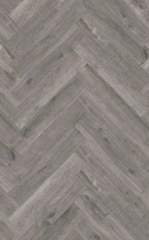 Close-up of Alva Millennium Oak LVT herringbone parquet design with detailed wood-effect finish.