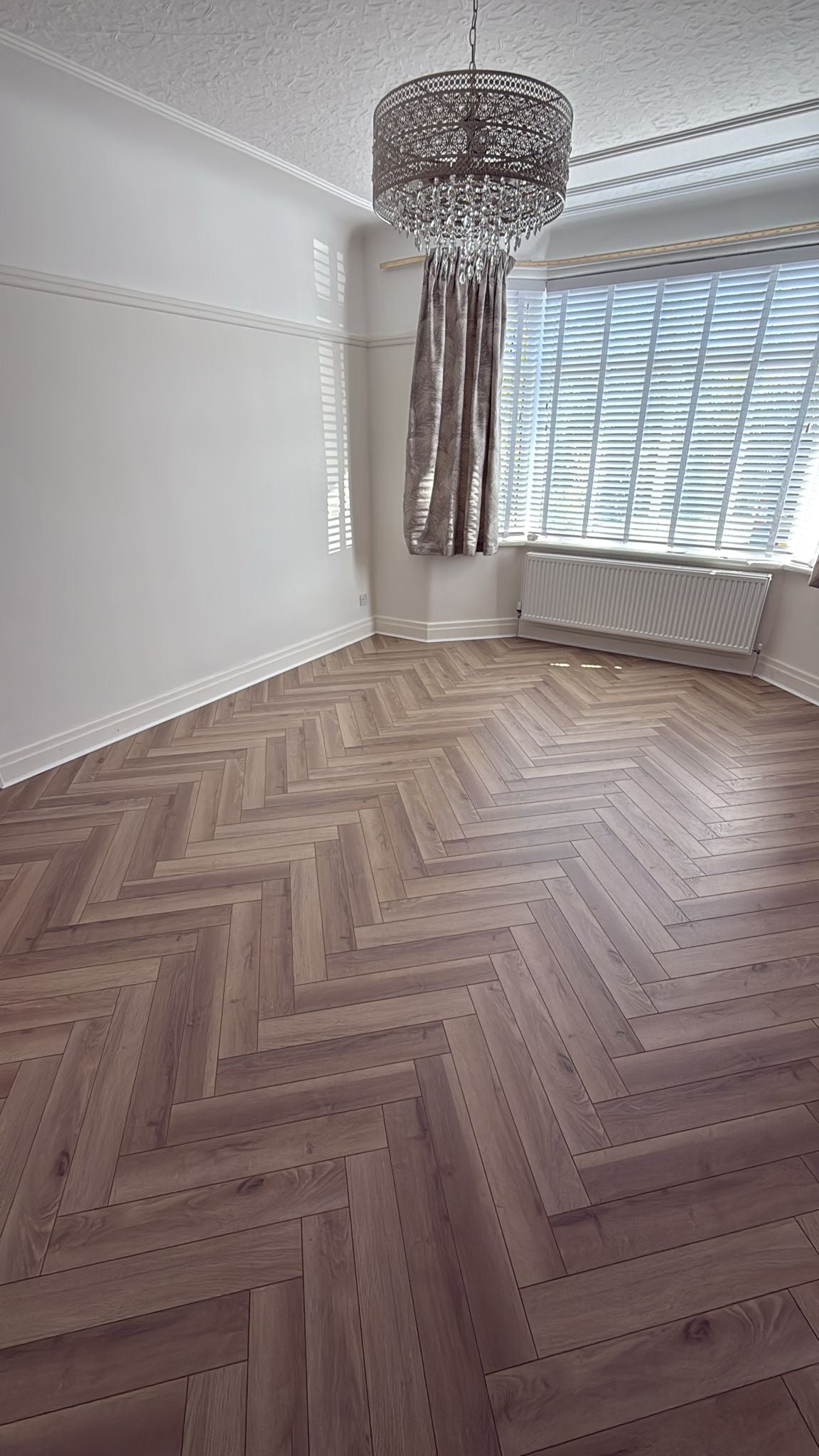 Grey Oyster Herringbone Laminate 12mm Click Fit Flooring