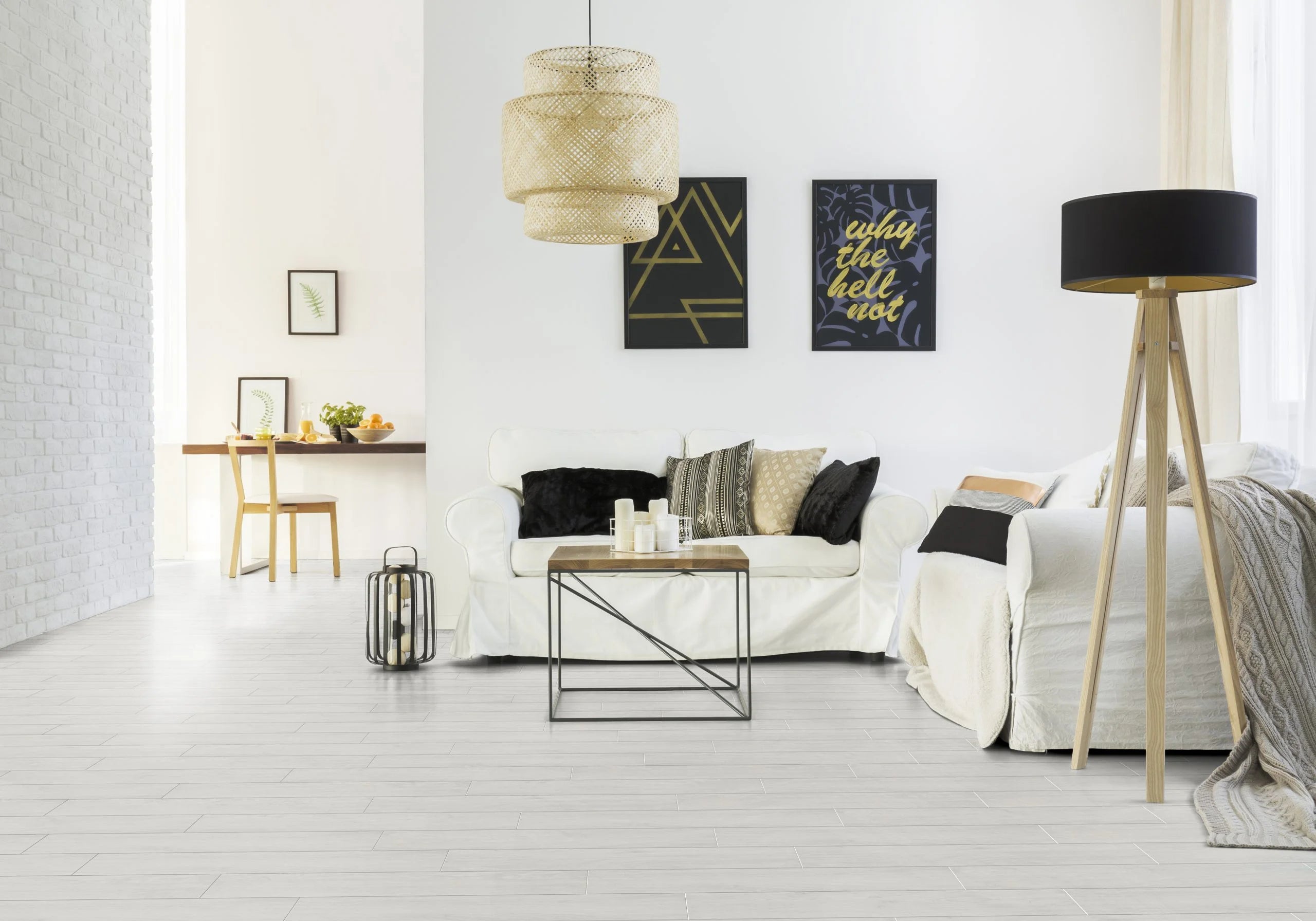 Luvanto Design Wood Plank flooring in Arctic Maple with light wood texture, in a living room with a sofa 