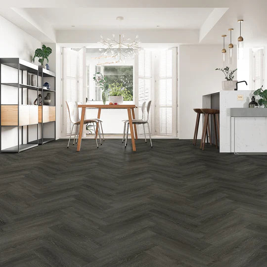 Ebony Oak Herringbone LVT flooring with deep, dark oak tones and micro bevel edges.