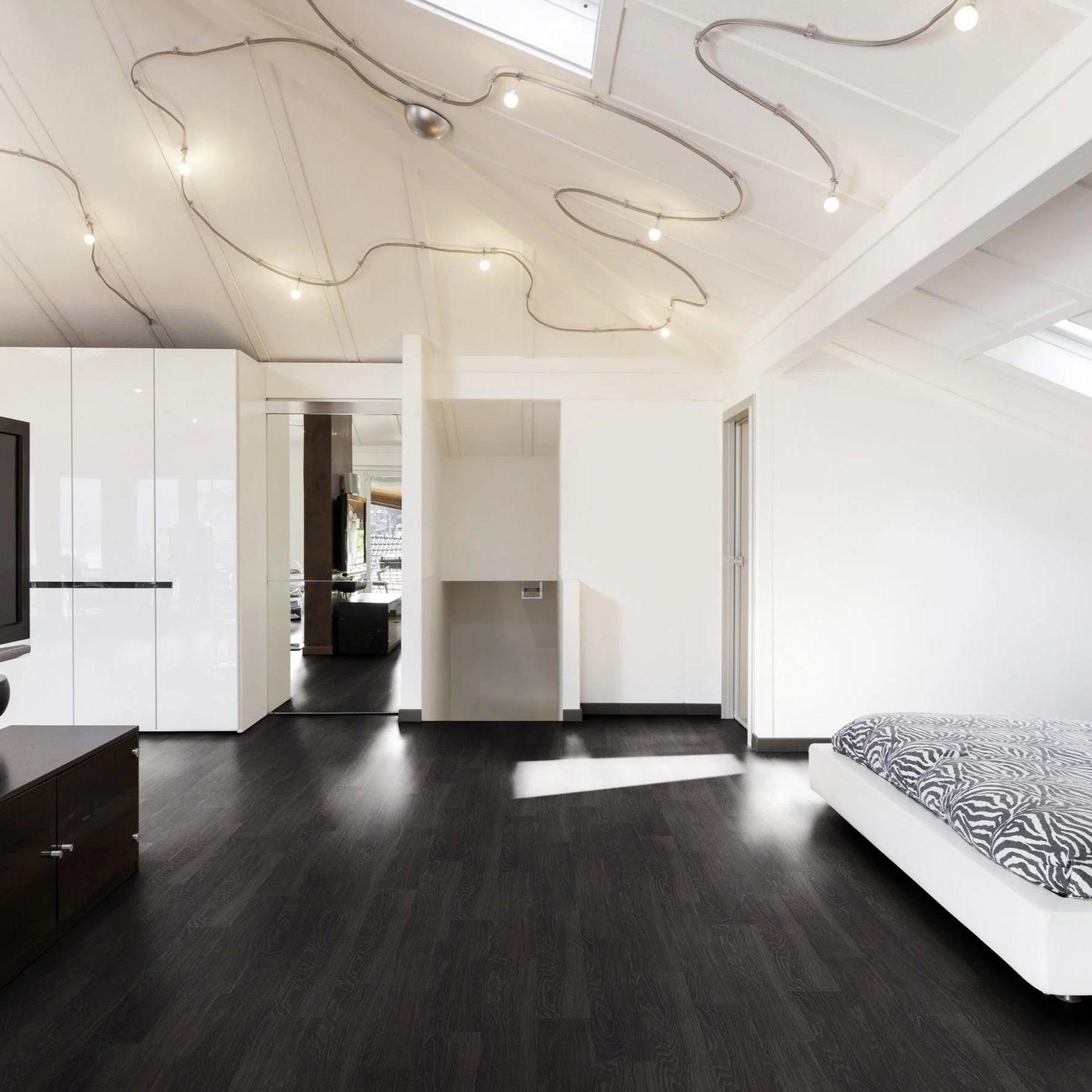 Black ash lvt plank flooring in a bedroom 