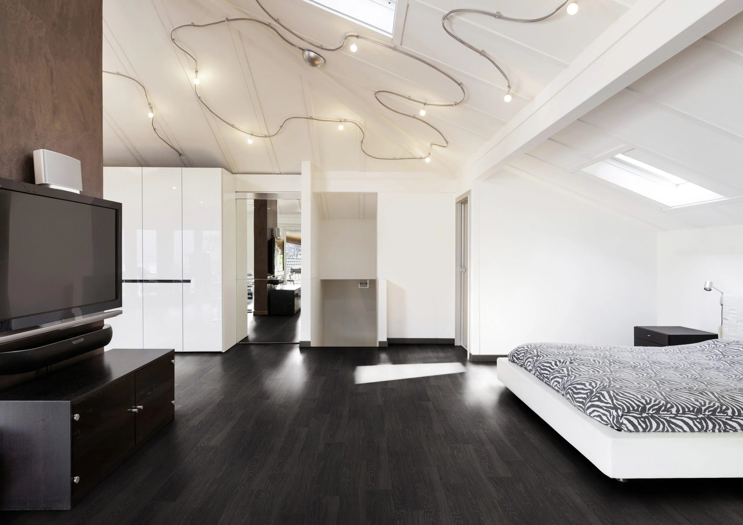 Black ash lvt plank flooring in a bedroom 