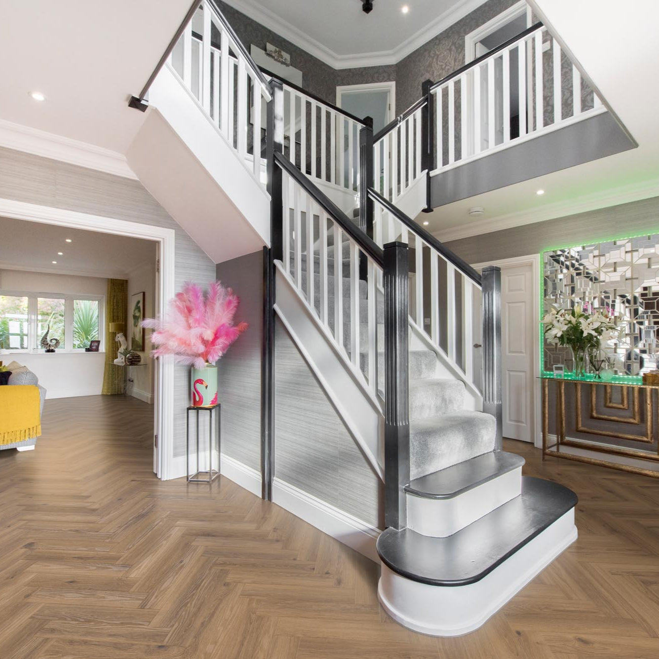 RHINO Evolution LVT in Parquet Chocolate, displayed in a hallway with dark wood effect flooring in a chic parquet layout, enhancing the space’s warmth and style