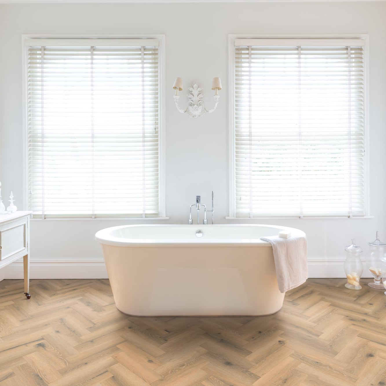 Rhinofloor Evolution LVT in Parquet Medburn, displayed in a modern bathroom with a beautiful medium brown wood effect, adding sophistication and charm.