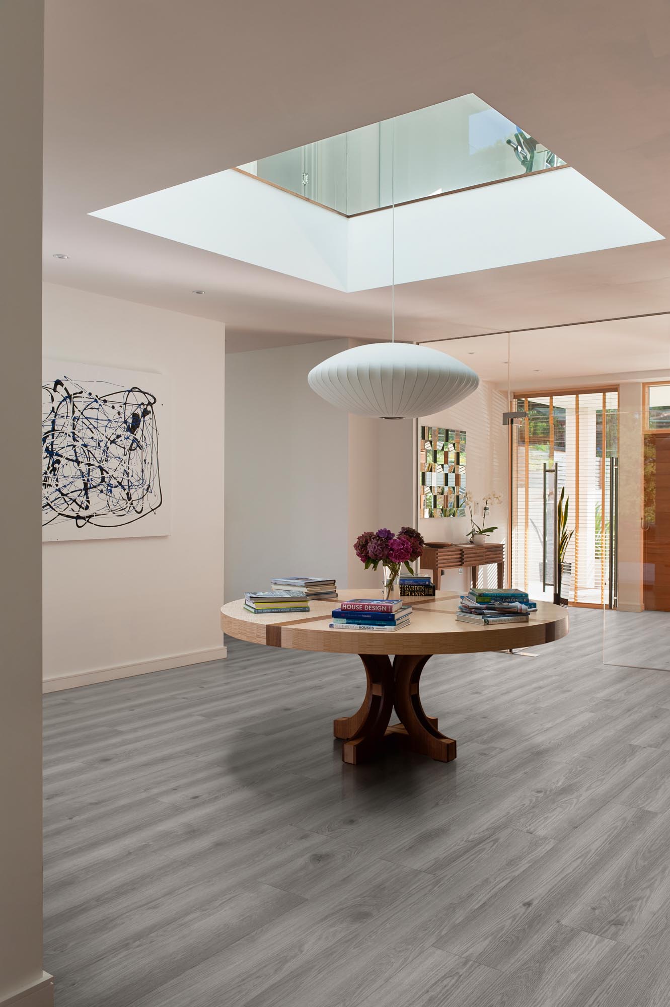 Timberwolf Plank LVT by Rhinofloor with grey wood tones for elegant interiors.