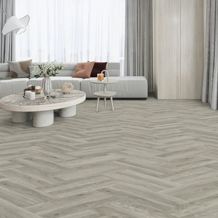 Pebble Shore Herringbone small plank LVT featuring soft grey tones with a micro bevel edge.