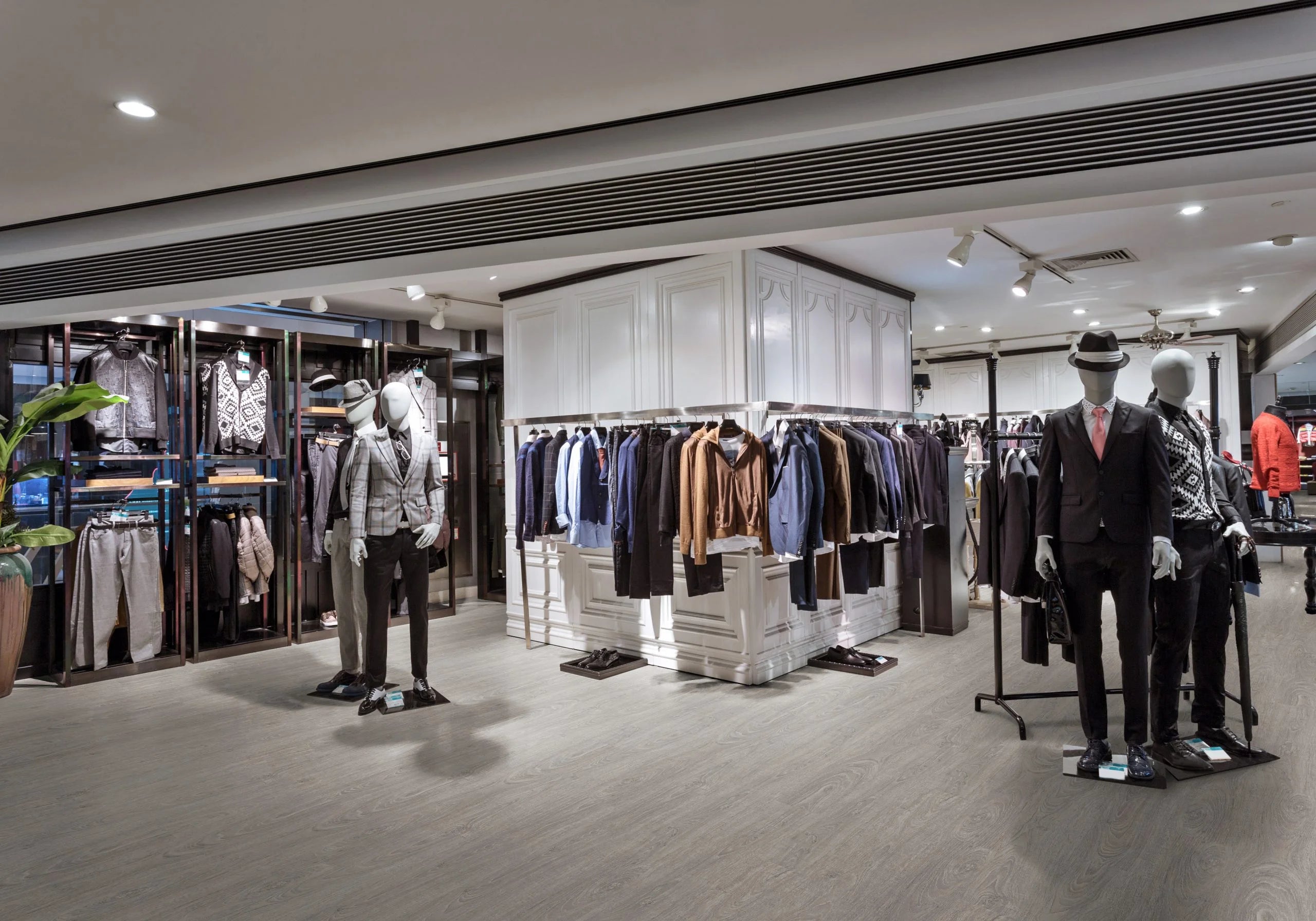 Washed Grey Oak Luvanto Design Wood Plank LVT flooring installed in a contemporary commercial space shop.