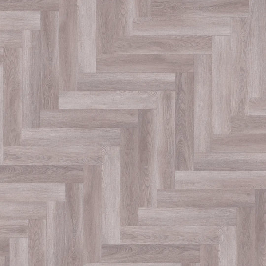 Close-up of Heather Grey Herringbone luxury vinyl tile showcasing the stylish herringbone pattern.