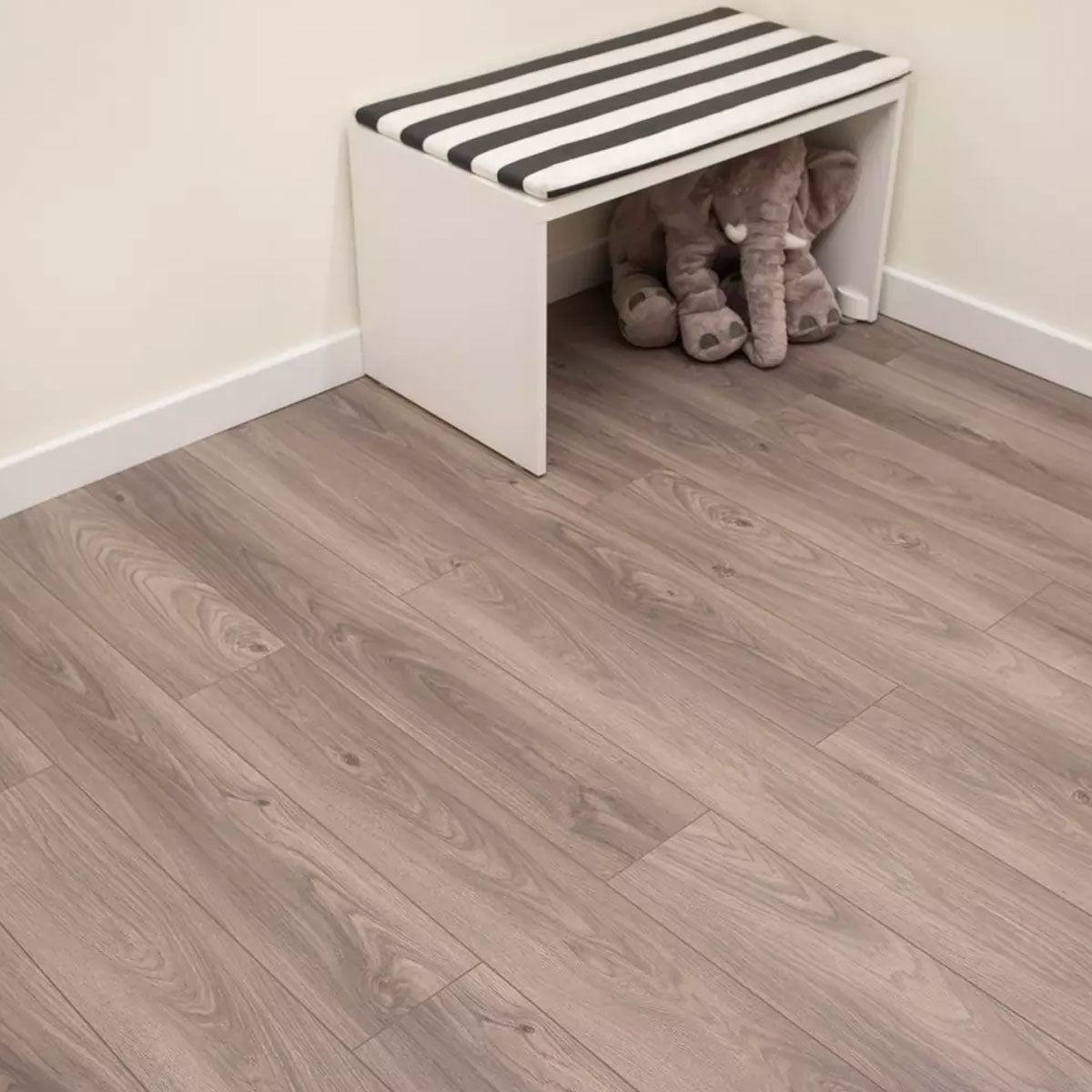 Love AQUA Dip laminate flooring in a serene living room with deep blue-grey accents