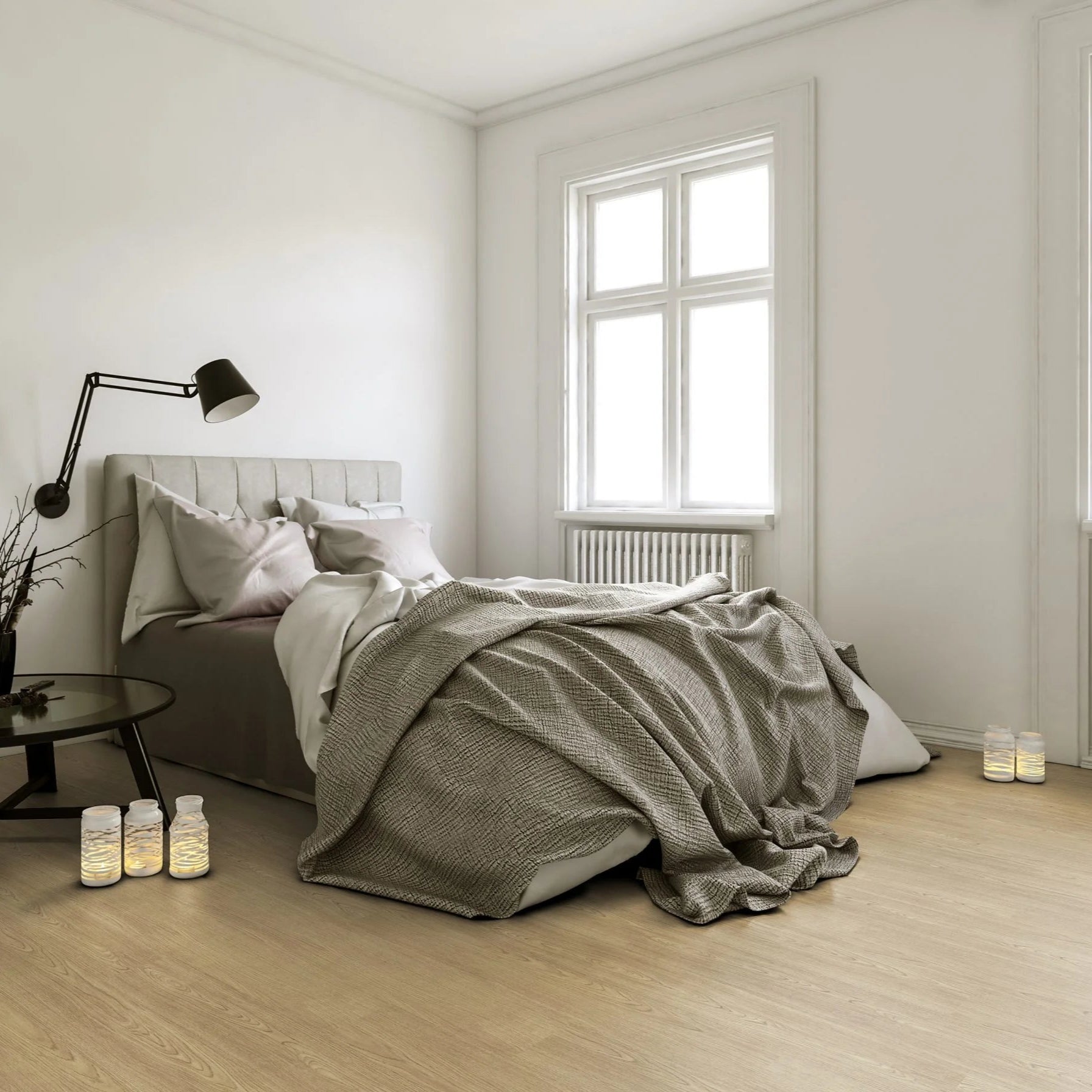 Luvanto Design Wood Plank flooring in Natural Oak with warm, golden wood tones in a bedroom