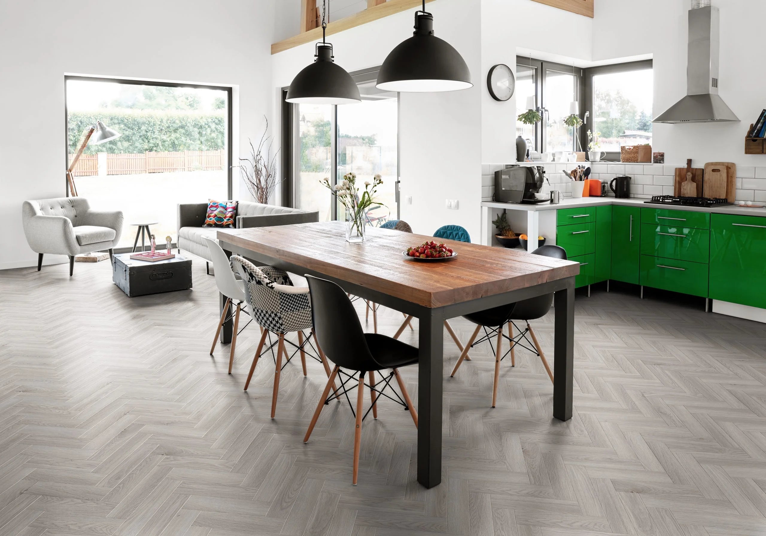 Luvanto pearl oak small plank herringbone in a contemporary modern kitchen dining area.