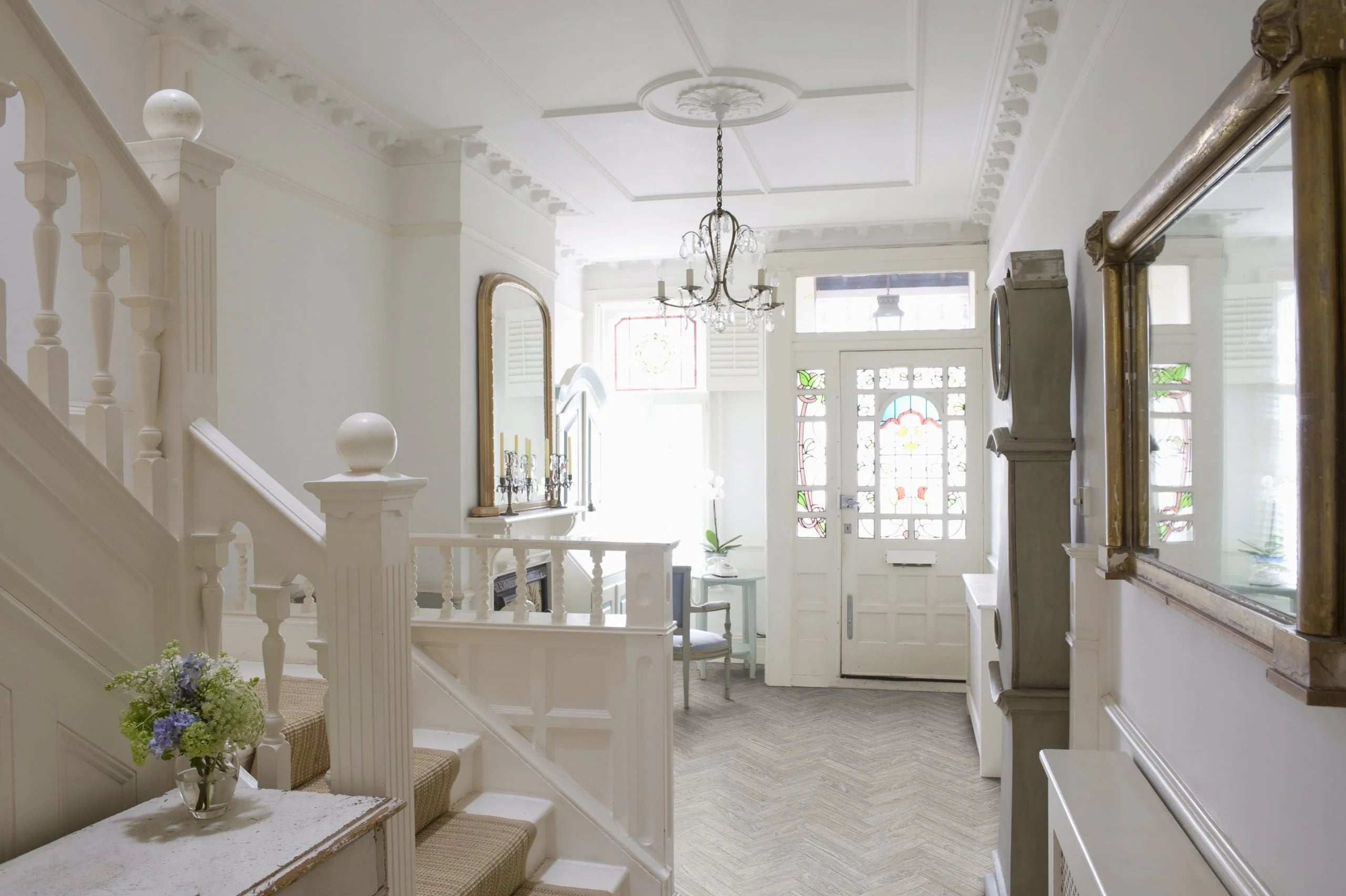 luvanto small plank herringbone glue donw lvt in a large entrance hallway.