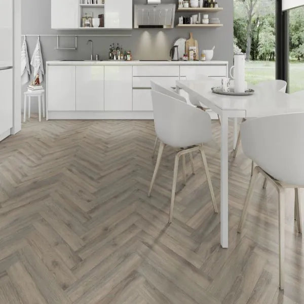 Driftwood laminate flooring with a textured wood-effect finish, showcasing light, neutral tones.