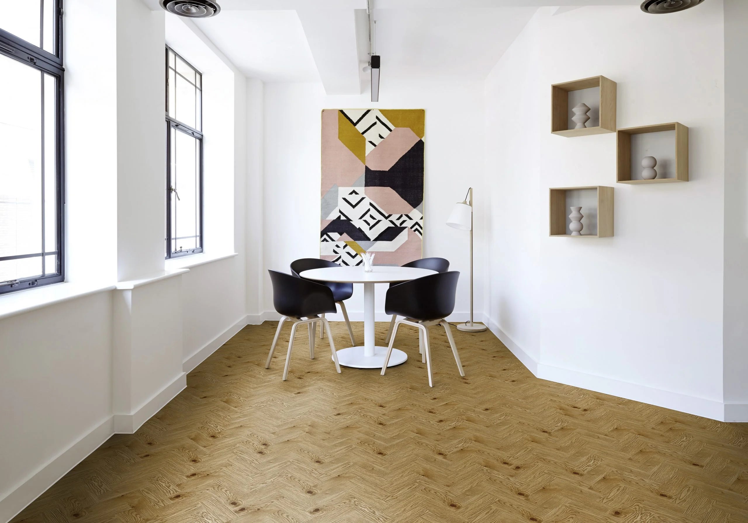 Country Oak herringbone lvt in a modern dining room with a table and chairs