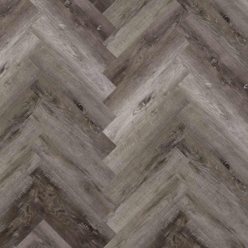 Bodo Herringbone SPC in Smoked Ash, featuring rich, smoky grey tones and a stylish herringbone pattern for a refined, contemporary look.