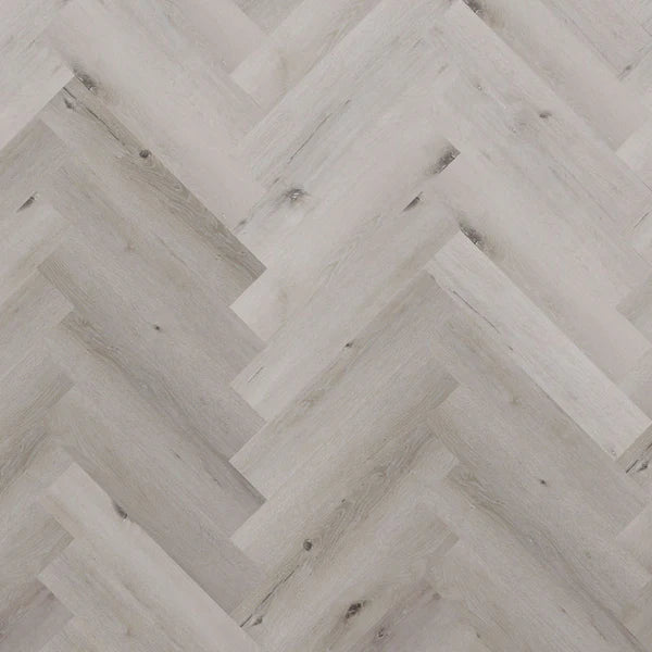 Tromso Herringbone LVT in White Maple, showcasing light wood tones and a classic herringbone pattern, perfect for bright and airy interiors.