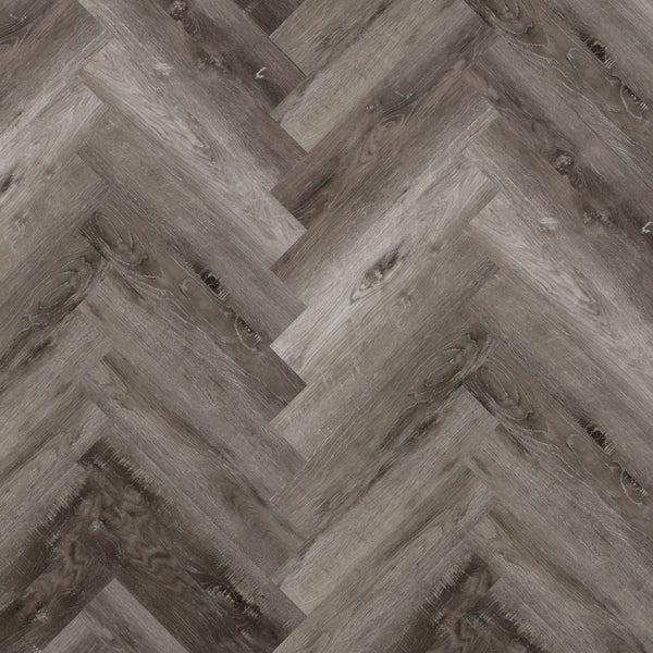 Tromso Herringbone LVT in Smoked Ash, featuring deep ash tones and a classic herringbone pattern, ideal for contemporary and traditional interiors.