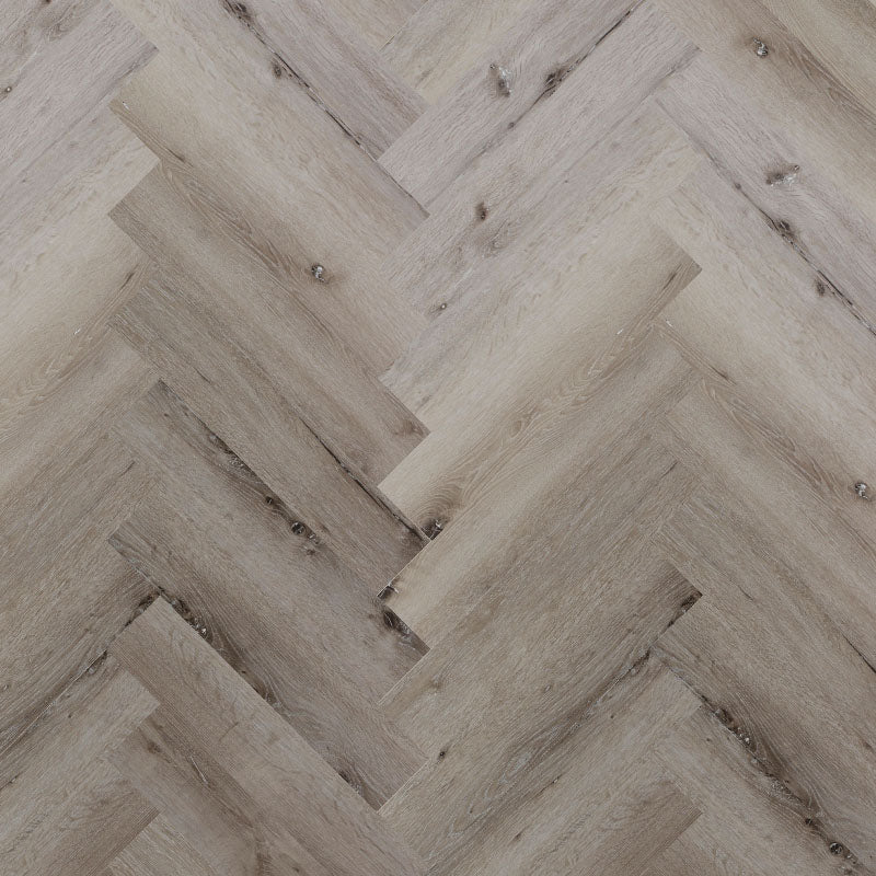 Bodo Herringbone SPC in Light Washed Oak, featuring soft neutral tones and a classic herringbone pattern for a fresh, contemporary look.