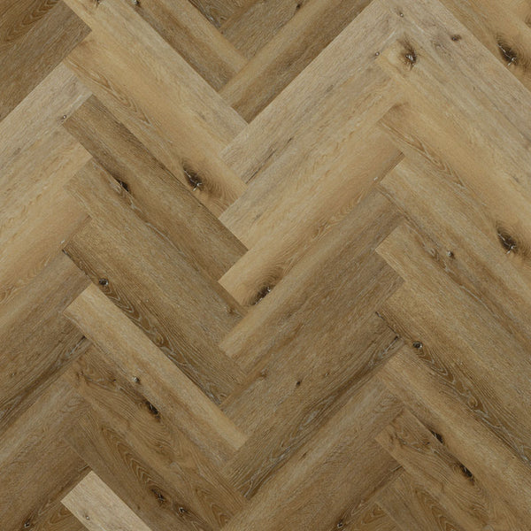 Tromso Herringbone LVT in Winter Oak, showcasing warm wood tones and a classic herringbone pattern, perfect for creating inviting interiors.