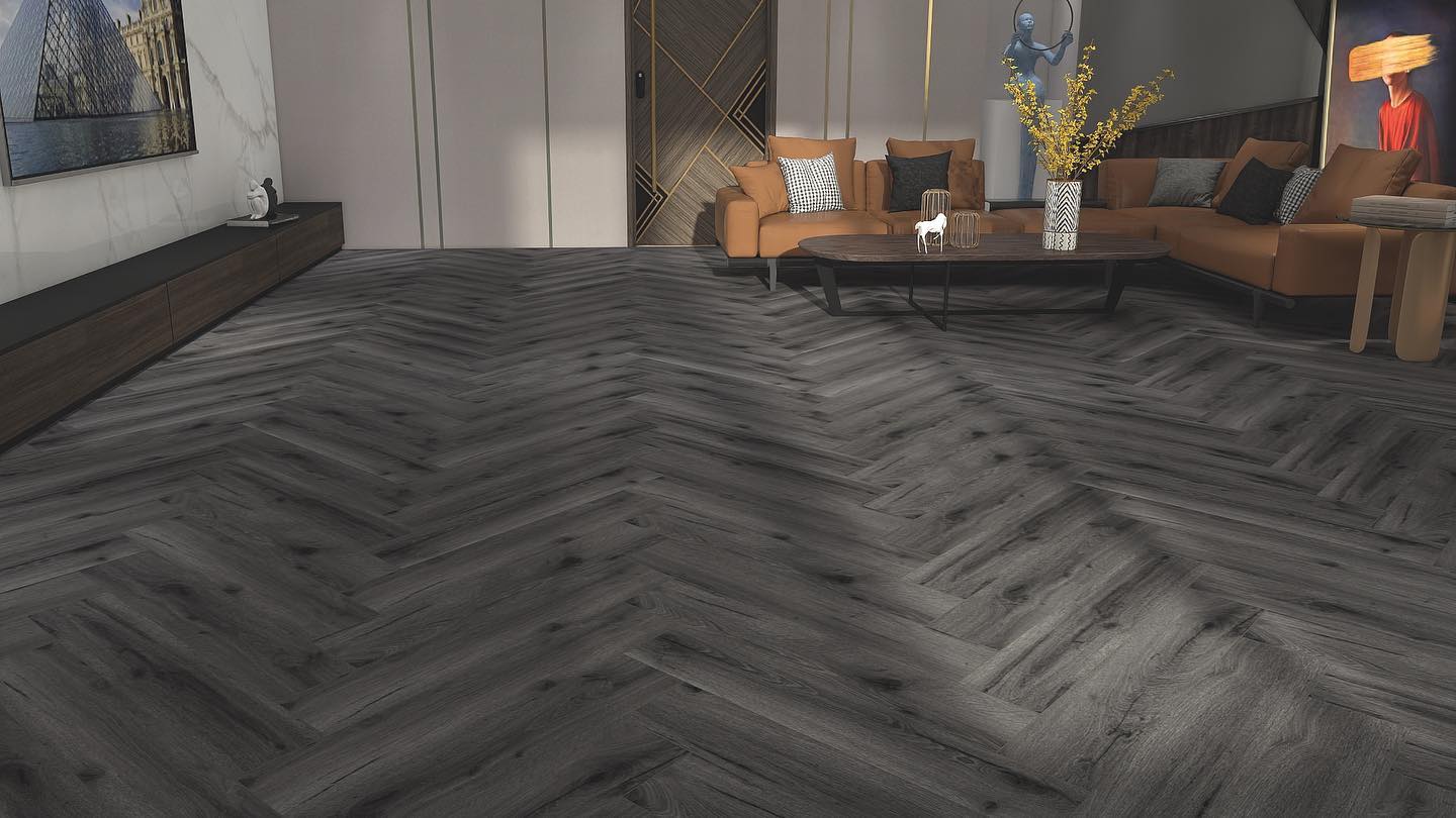 Luxurious herringbone laminate flooring in a rich wood-effect finish, showcasing a warm and inviting interior.