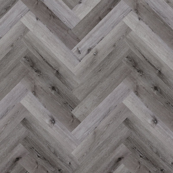 Tromso Herringbone LVT in White Maple, featuring light natural wood tones and a sophisticated herringbone design, ideal for modern interiors.