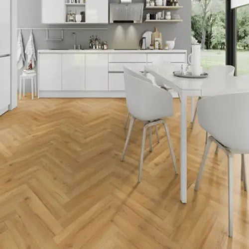 Premium 12mm Herringbone Laminate in Cedar Oak, featured in a modern dining room and kitchen with a warm wooden finish